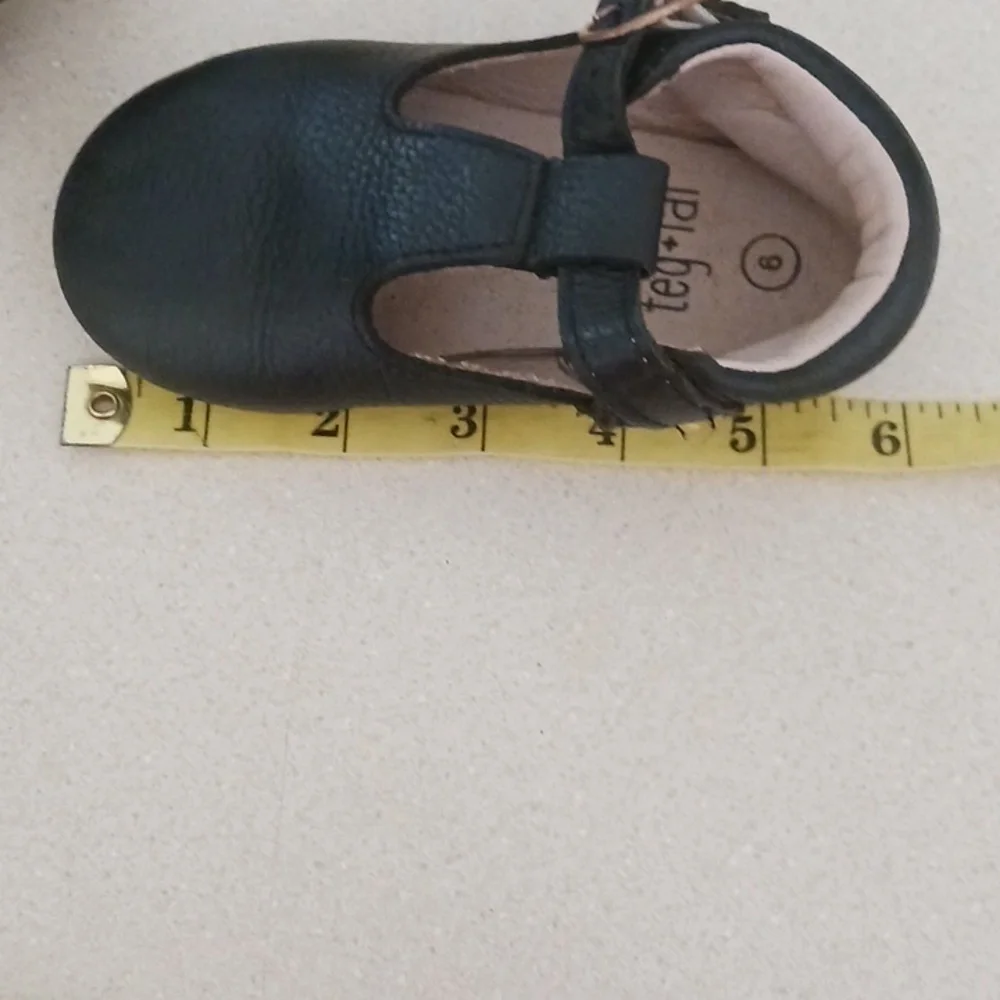 Teg+Lai  T Strap Black Rubber Flex Sole Shoes